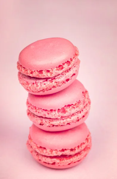 Macaroons on light pink  background
