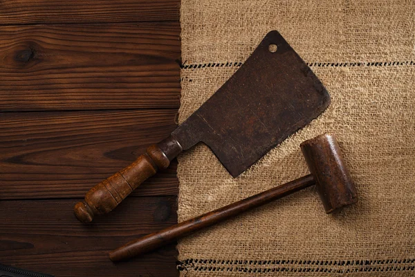 Wooden mallet and iron meat cleaver