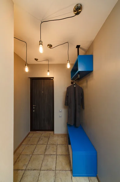 Interior hallway in an apartment with a lot of incandescent ligh