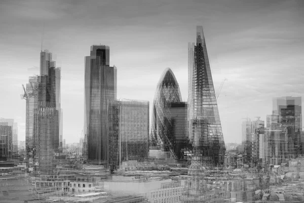 City of London financial district square mile skyline with storm abnd double exposure effect