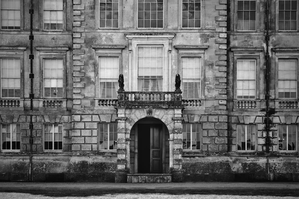 Unidentified old English mansion house with balcony overlooking