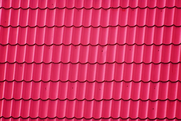 Roof Covered with Red Corrugated Metal Tiles