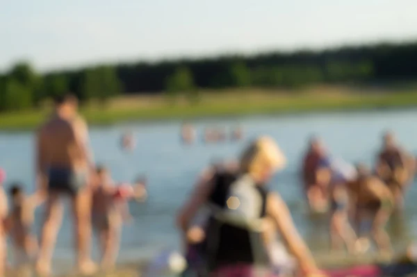 Background-abstraction, people bathe in lake.