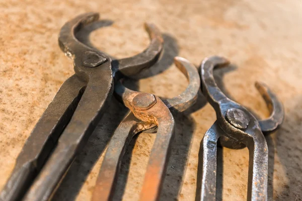 Old tools on rusty steel