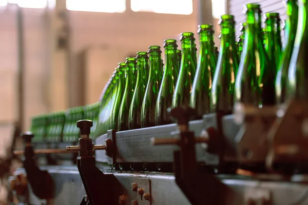 Many bottles on conveyor belt