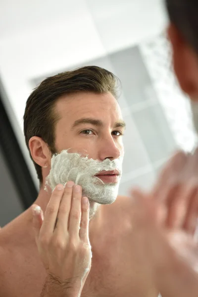 Man shaving with foam