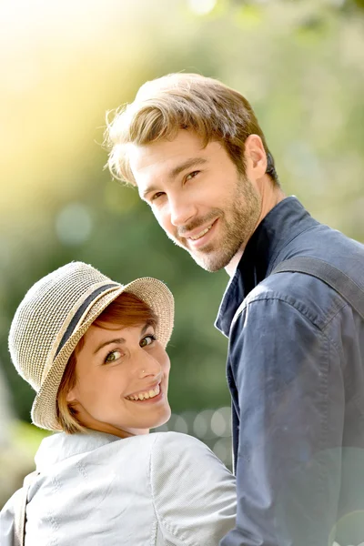 Couple walking in city park