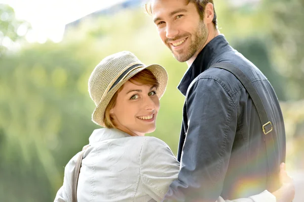 Couple walking in city park