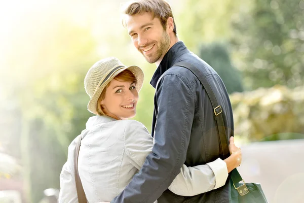 Couple walking in city park