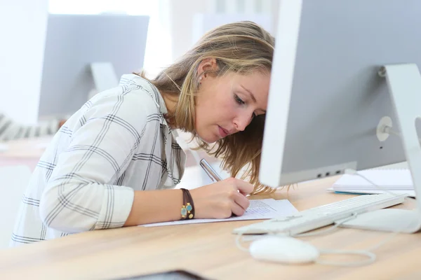 Girl writing an exam