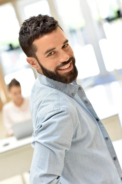 businessman smiling in meeting room