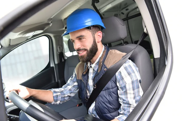 Technician sitting in vehicle