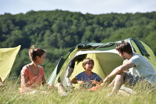 Family  in camp tent