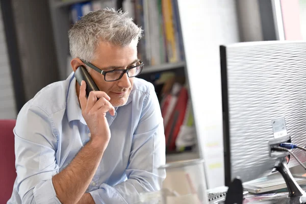 Businessman in office talking