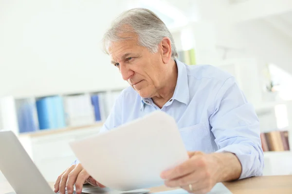 Man working on laptop computer