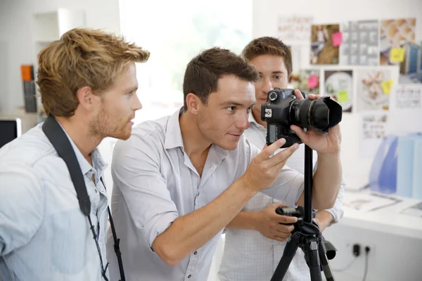 Photographer with students in training class
