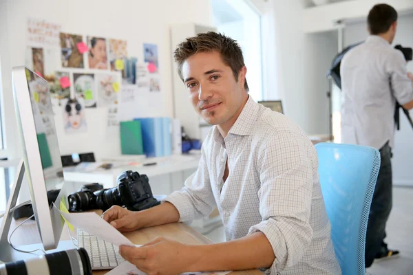 Photographer working in communication agency