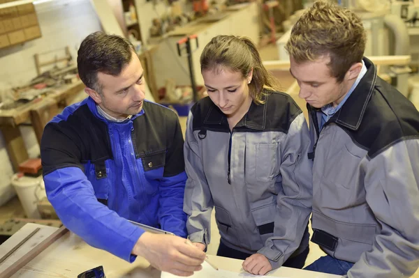 Students in woodwork training course