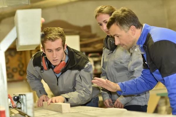 Students in woodwork training course