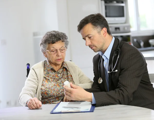 Doctor visiting elderly woman
