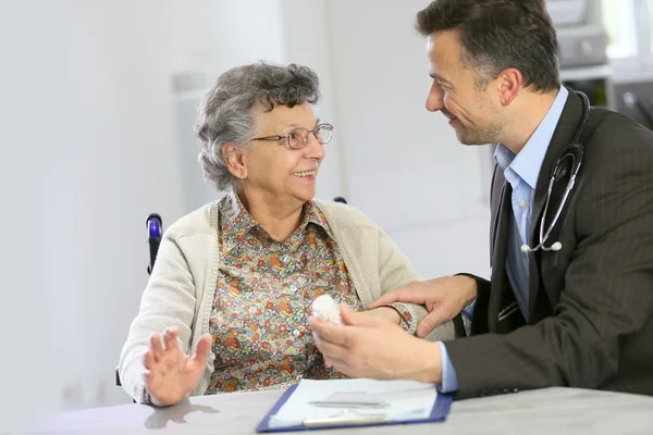Doctor visiting elderly woman