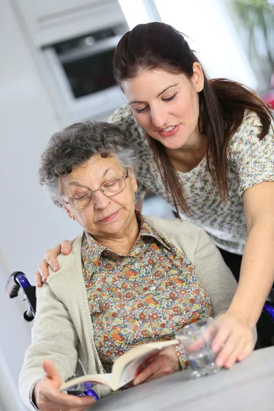 Elderly woman with home carer