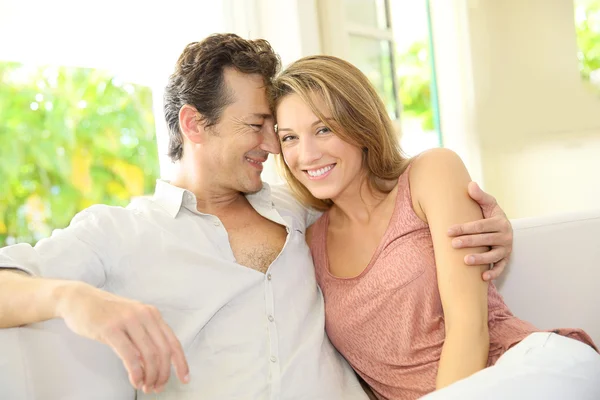 Couple relaxing on couch