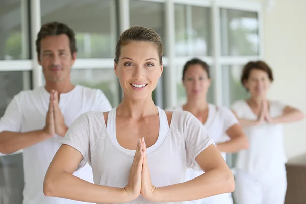 Woman attending yoga course