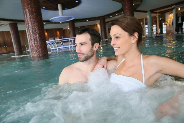 Couple in spa center jacuzzi