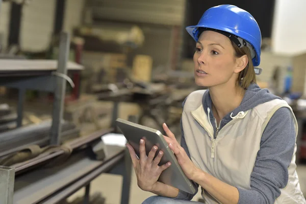 Woman engineer using tablet