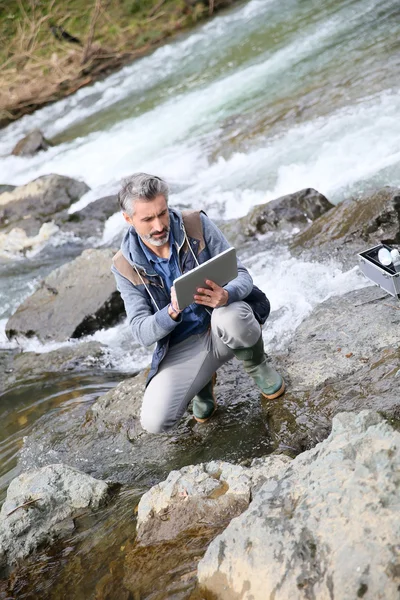 Biologist testing quality of water