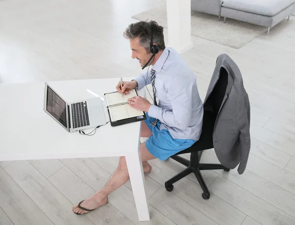 Businessman on video meeting from home