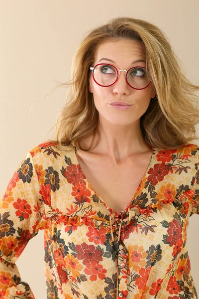 Attractive trendy woman in eyeglasses posing