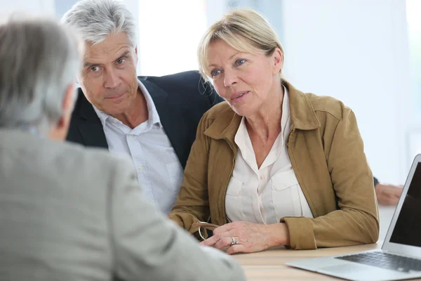 Couple meeting real-estate agent