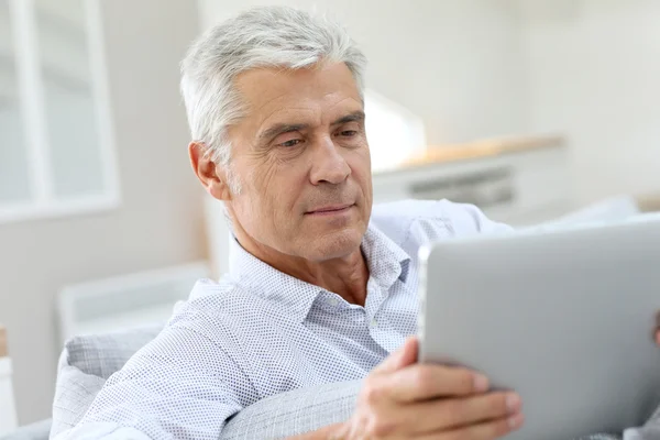 Senior man  using digital tablet