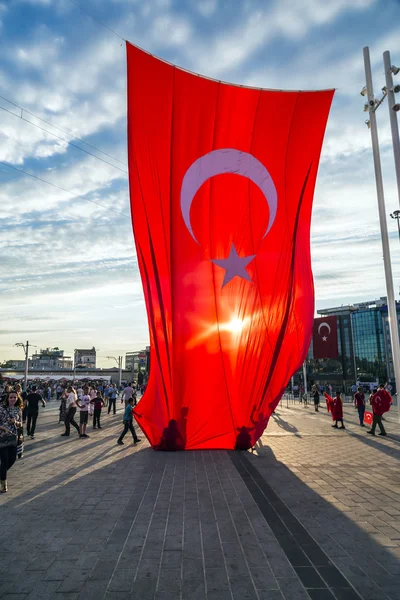 Turkish people gathering and waving flags at Taksim Square. The meetings were called Duty for Democracy after the failed July-15 coup attempt of Gulenist militants.