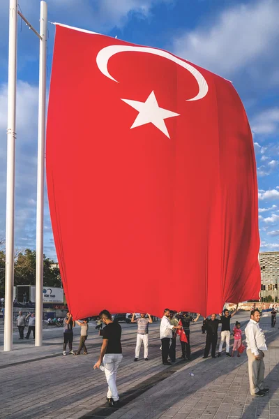 Turkish people gathering and waving flags at Taksim Square. The meetings were called Duty for Democracy after the failed July-15 coup attempt of Gulenist militants.