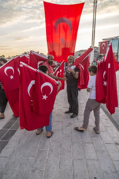 Turkish people gathering and waving flags at Taksim Square. The meetings were called Duty for Democracy after the failed July-15 coup attempt of Gulenist militants.