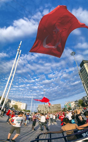 Turkish people gathering and waving flags at Taksim Square. The meetings were called Duty for Democracy after the failed July-15 coup attempt of Gulenist militants.