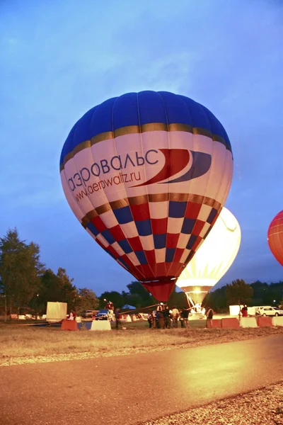 Hot Air Balloon over evening summer lake