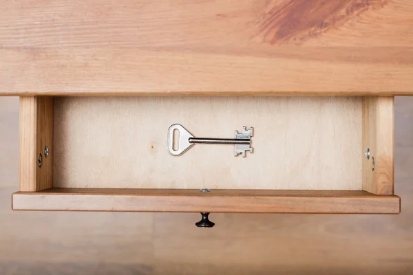 One safe key in open drawer