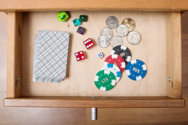 Deck of playing cards in open drawer