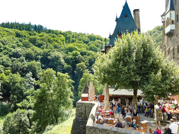 Tourists in Castle Eltz above Mosel river, Germany