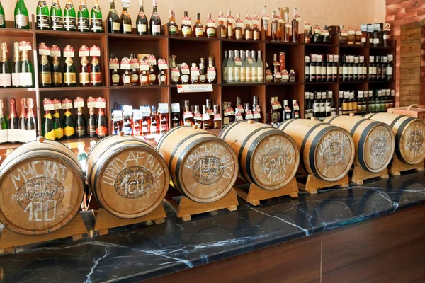 Crimean wine in barrels and bottles in shop