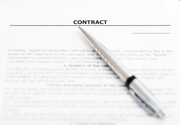 Silver pen on sheet of sales contract