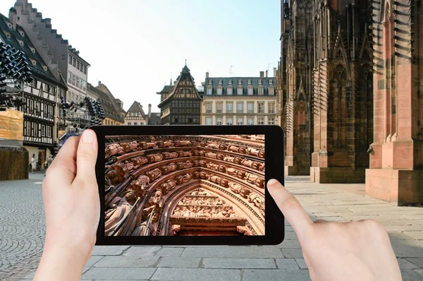 Tourist taking photo of cathedral in Strasbourg