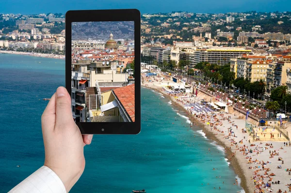 Tourist taking photo of Nice city on Azure coast