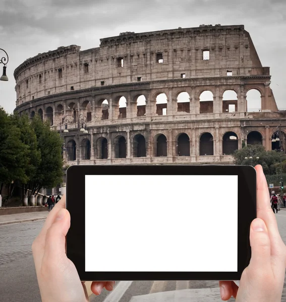 Tourist photographs of Coliseum in Rome