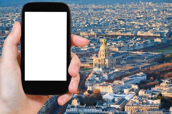 Smartphone with cut out screen and Paris cityscape
