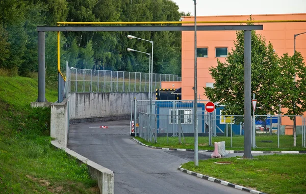 Crossing guard at the entrance to warehouse